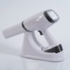 IDEN-X2 handheld dental X-ray unit with charging dock — touchscreen display visible