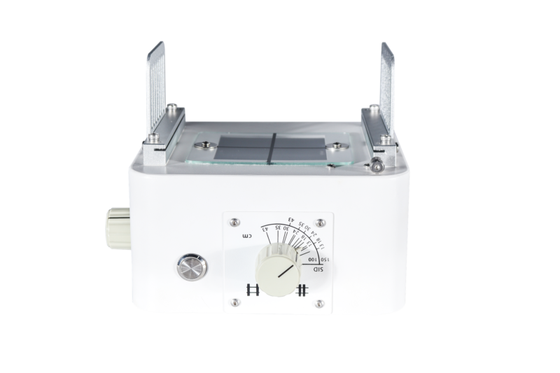 Manual X-ray collimator front view with light field window, cross-hair and the SID and field size dial