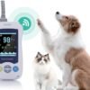 VM2 handheld pulse oximeter shown with canine and feline patients