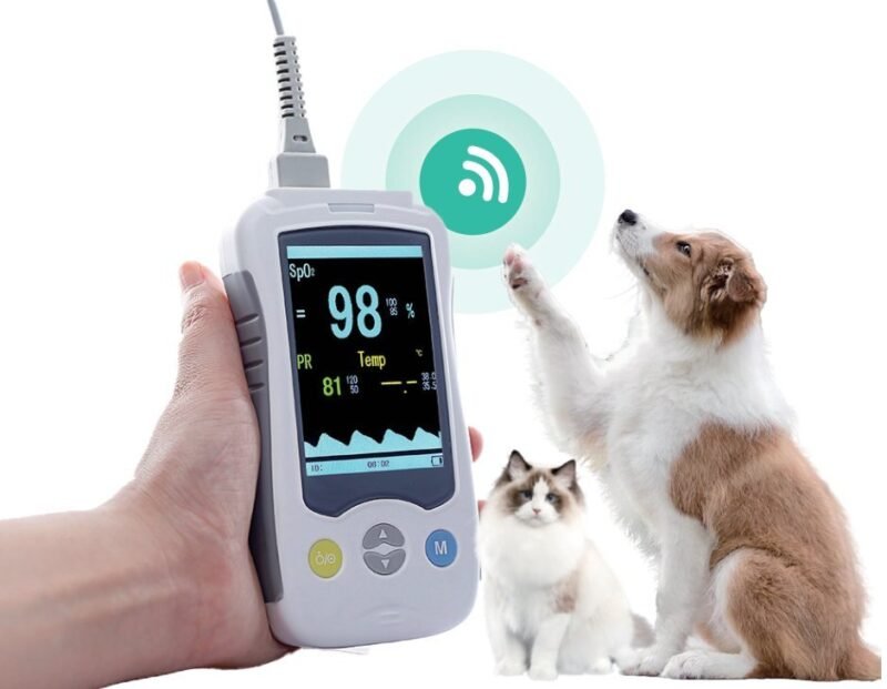 VM4 handheld pulse oximeter with SpO2 sensor cable, shown with canine and feline patients